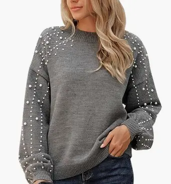 Oversized chunky crewneck sweater with pearl embellishments styled with jeans for fall