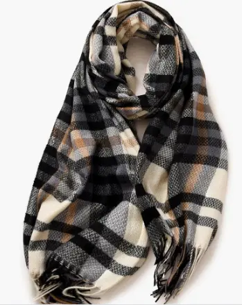 Multicolor plaid scarf styled over a neutral sweater for fall