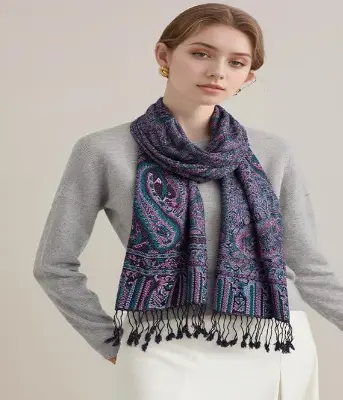 Soft pashmina-feel scarf styled over a neutral sweater for fall layering