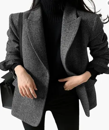 Single-breasted wool blend blazer styled over a blouse and trousers for fall