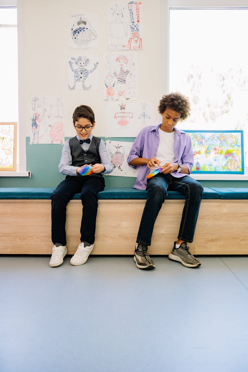 Two children playing with a sensory fidget pop toy to cope with sensory overload