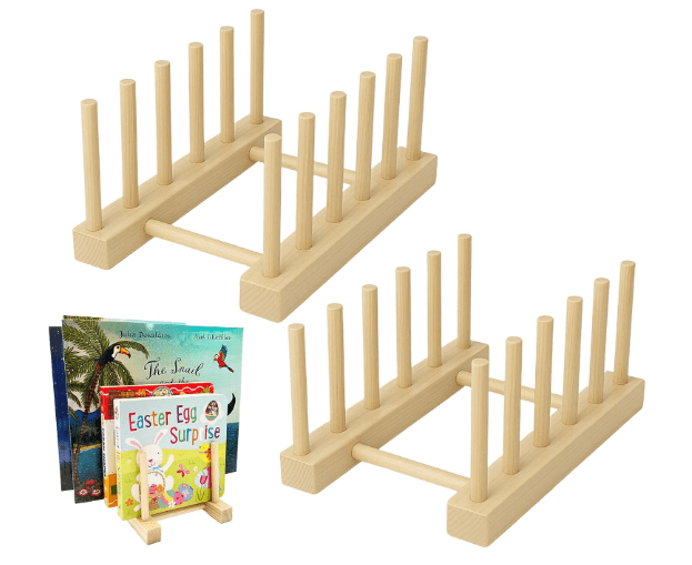 Small wooden book rack on a child’s desk holding storybooks and notebooks