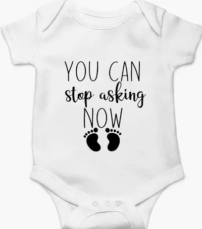 Baby onesie with the message “You can stop asking now” for pregnancy announcement to grandparents