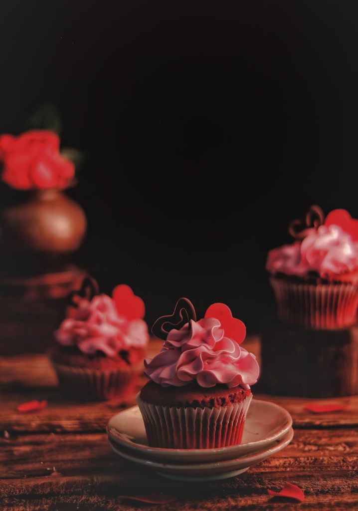 Heart-shaped cupcakes on a plate, symbolizing small, sweet Valentine’s Day gestures for new moms